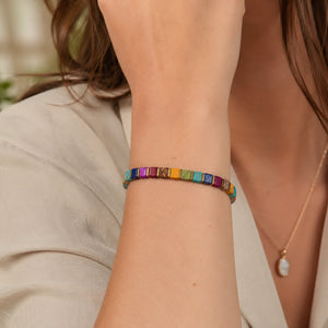 Multi imperial jasper bracelet with golden hematite styled on a woman's wrist for everyday tranquility