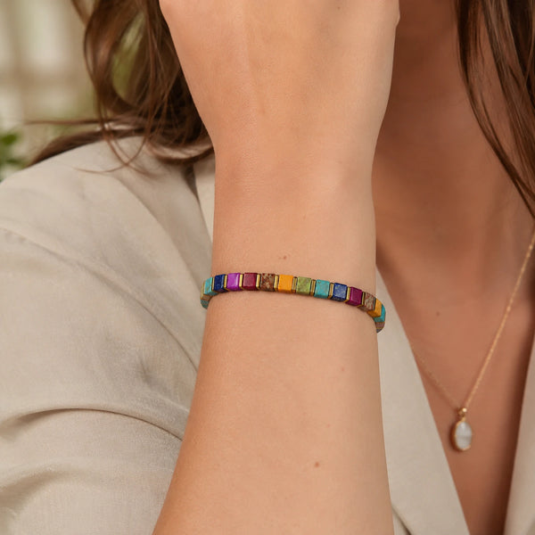 Multi imperial jasper bracelet with golden hematite styled on a woman's wrist for everyday tranquility