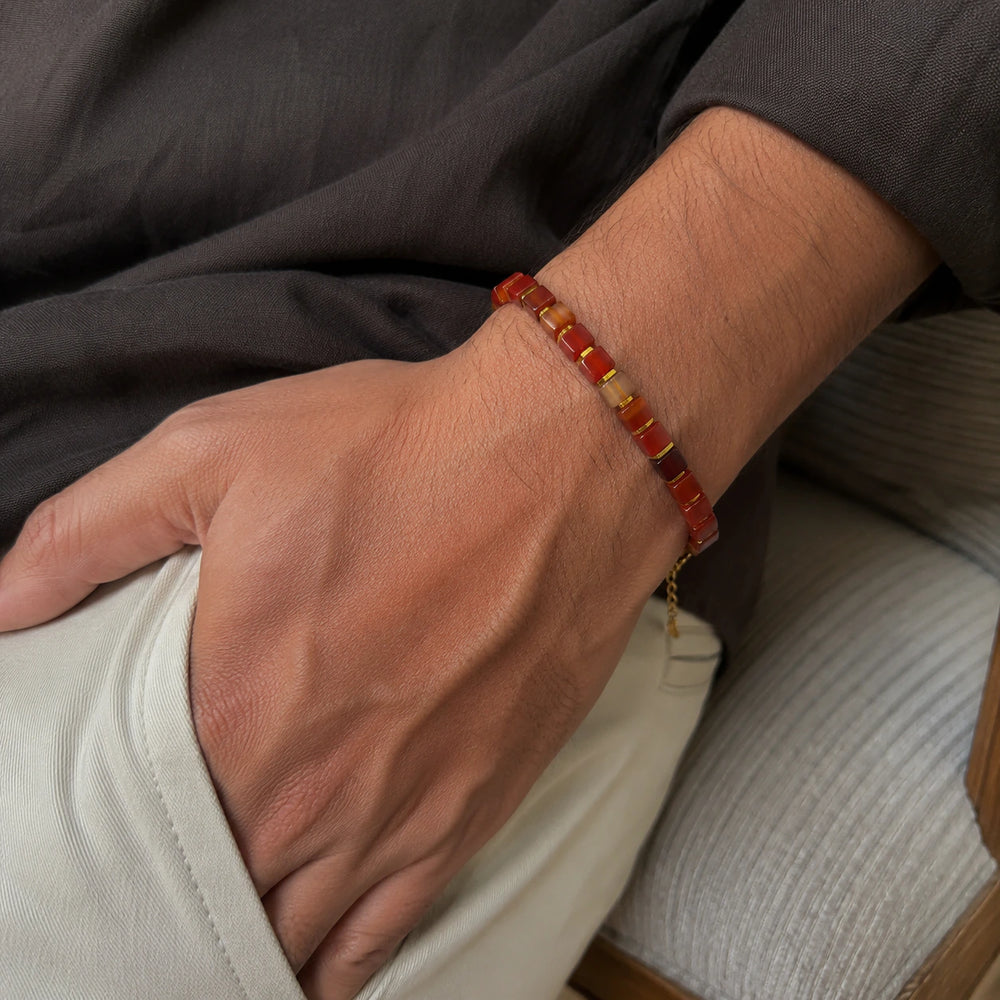 Natural red striped agate bracelet with golden hematite beads for strength - Soultheory India