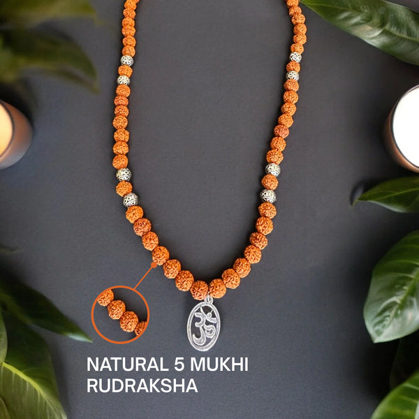 Silver Om pendant on a natural 5 mukhi rudraksha mala with zoom detail of the beads
