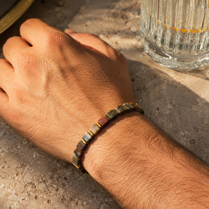 Unisex Picasso jasper bracelet with golden hematite on wrist, everyday spiritual jewellery for men