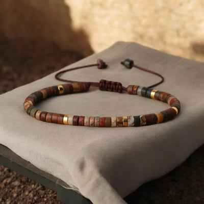 Natural picasso jasper heishi bead bracelet with gold accents for creativity - Soultheory India