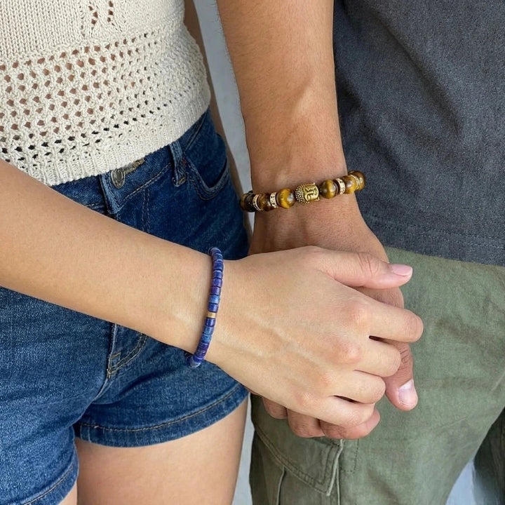 Couple wearing tiger eye and lapis lazuli success bracelets on their wrists - Soultheory India