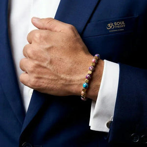 Purple jasper bracelet worn on wrist with navy suit, colourful beads and stainless steel chain