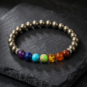 Pyrite with 7 Chakra Bracelet on black slate, polished pyrite beads with seven chakra stones