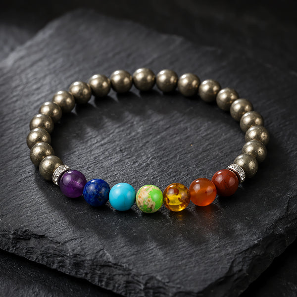 Pyrite with 7 Chakra Bracelet on black slate, polished pyrite beads with seven chakra stones