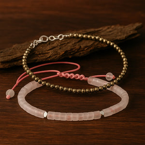 Pyrite anklet and rose quartz bracelet combo flat lay on dark wood with bark