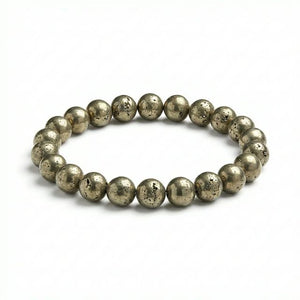 Raw pyrite stretch bracelet with golden metallic beads on white background
