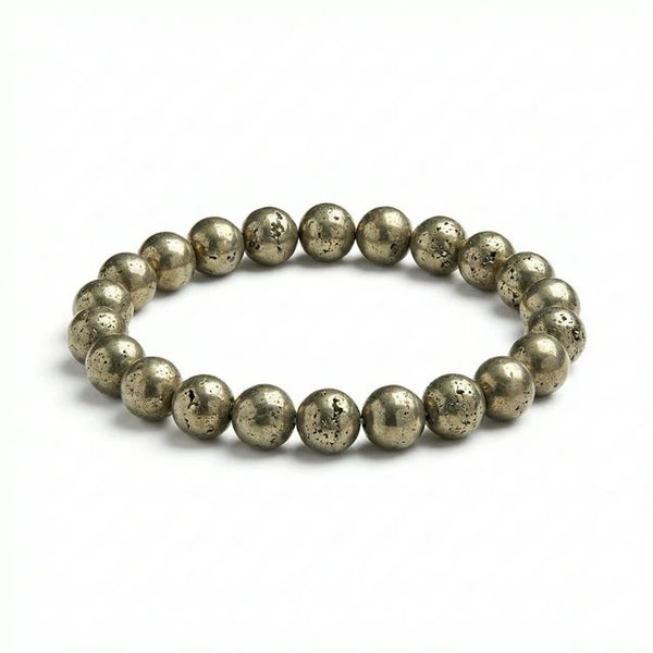 Raw pyrite stretch bracelet with golden metallic beads on white background