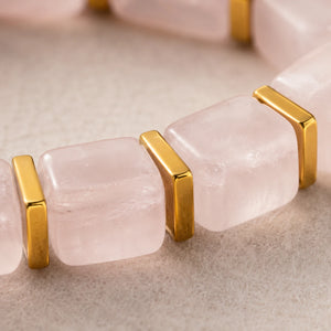 Close-up of pale pink rose quartz cube beads with polished gold hematite spacers, Soultheory detail