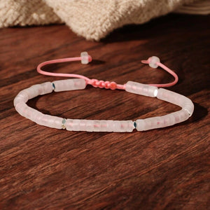 Rose quartz heishi bracelet with pink adjustable cord and silver accents for love and self-care