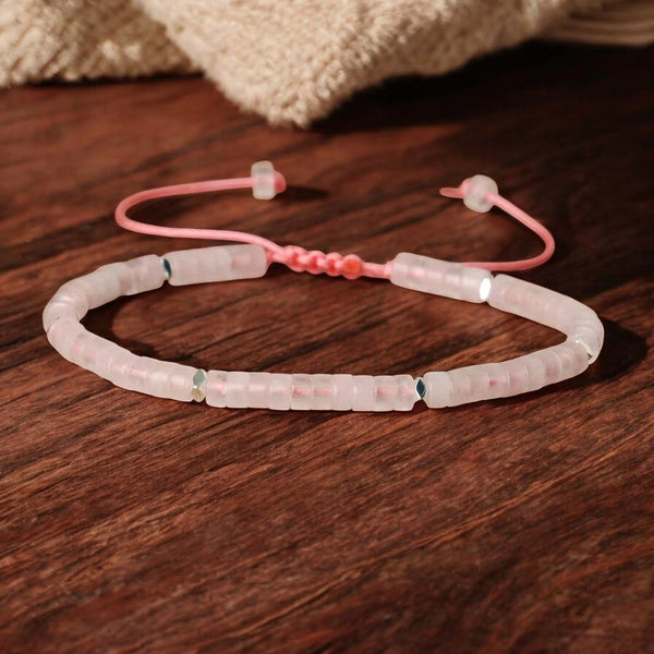 Rose quartz heishi bracelet with pink adjustable cord and silver accents for love and self-care