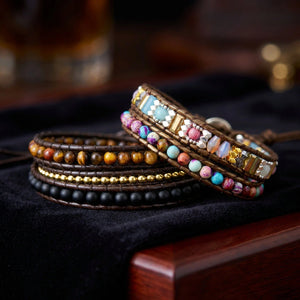 Matching tiger eye triple protection and colourful imperial jasper wrap bracelets shown on velvet