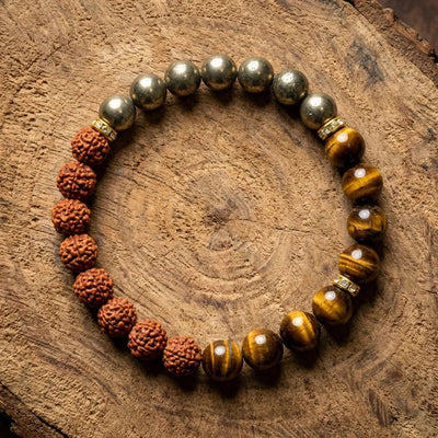 Rudraksha, pyrite and tiger eye bracelet on wood for peace and courage - Soultheory India