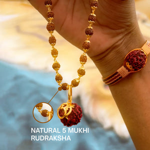 Gold plated Om Shree rudraksha necklace held in hand with natural 5 mukhi panchmukhi beads