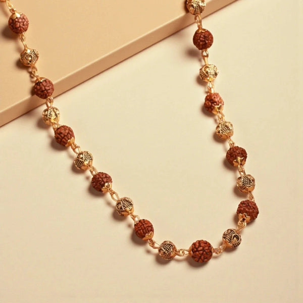 Rudraksha vel mala laid flat showing alternating rudraksha and gold plated beads