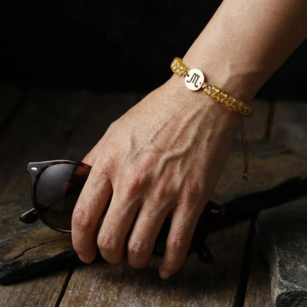 Scorpio zodiac yellow citrine stone bracelet with gold sign charm for focus and passion - Soultheory India