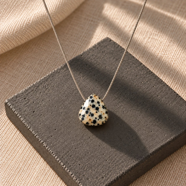 Dalmatian Fine Cord Necklace - hero photograph on a styled surface