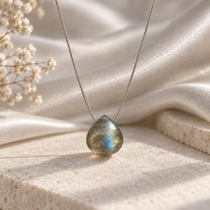Opaque Labradorite fine cord necklace hero on limestone