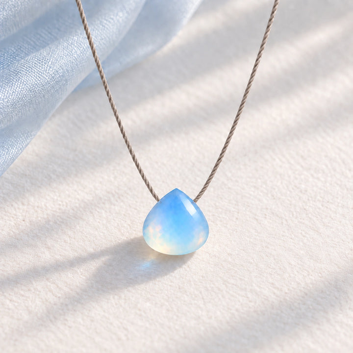 Opal Fine Cord Necklace - hero photograph on a styled surface