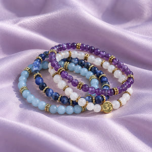 Soultheory Spiritual 4 mm bracelet stack with Amethyst, Sodalite - fabric styling photograph