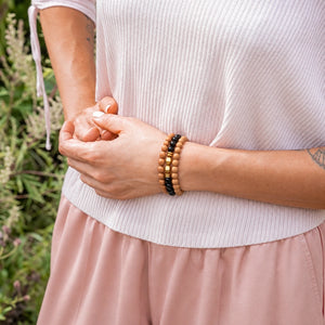 Black Onyx and Rosewood set of 3 bracelets worn on a female wrist