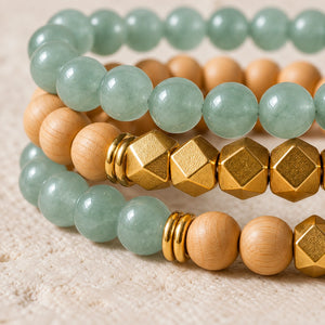 Macro close-up of Green Aventurine beads, rosewood and gold-tone accents