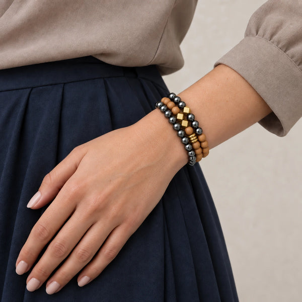 Hematite and Rosewood set of 3 bracelets worn on a female wrist
