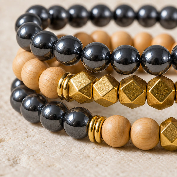 Macro close-up of Hematite beads, rosewood and gold-tone accents