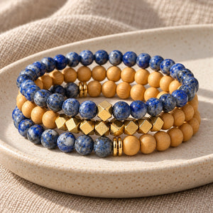 Three Lapis Lazuli and Rosewood bead bracelets stacked on an ivory tray