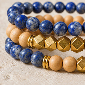 Macro close-up of Lapis Lazuli beads, rosewood and gold-tone accents