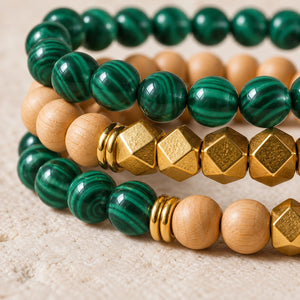 Macro close-up of Malachite beads, rosewood and gold-tone accents