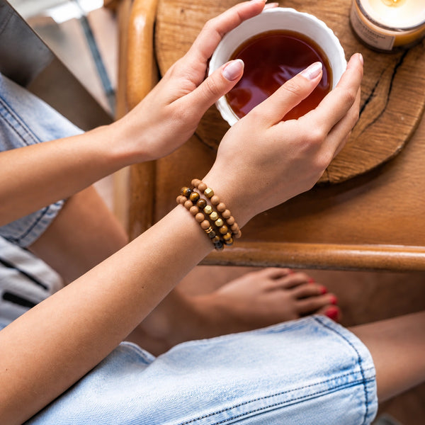 Tiger Eye and Rosewood set of 3 bracelets worn on a female wrist