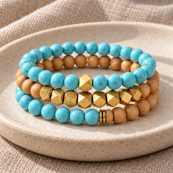 Three Turquoise and Rosewood bead bracelets stacked on an ivory tray