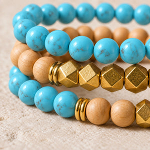 Macro close-up of Turquoise beads, rosewood and gold-tone accents