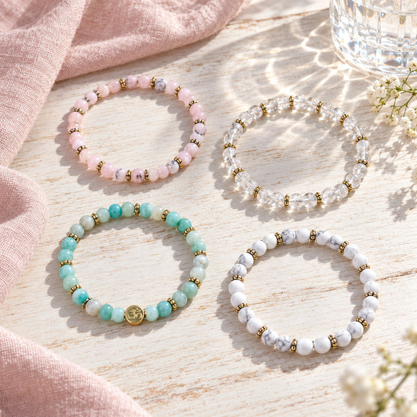 Soultheory Stress 4 mm bracelet stack with Pink Opal, Amazonite - four bracelets on a sunlit table