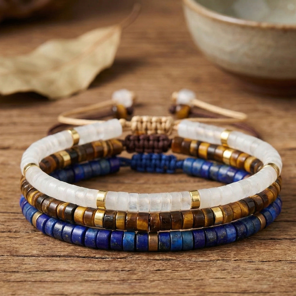 Clear quartz, tiger eye and lapis lazuli exam success bracelet set stacked on wood - Soultheory India
