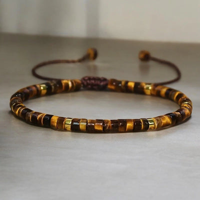 Natural tiger eye stone bracelet with gold accent beads for confidence and protection - Soultheory India