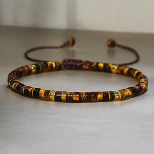 Close-up of tiger eye bracelet with golden brown heishi beads for focus and willpower